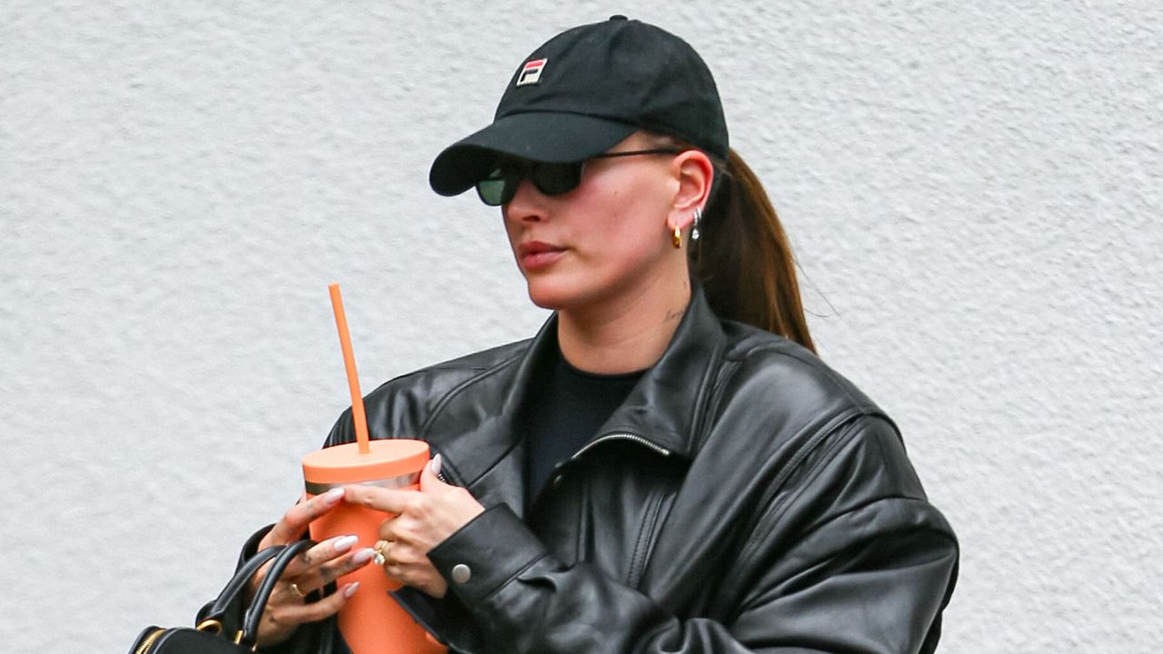 Hailey Bieber wears black leather jacket and white sneakers after pilates class in Los Angeles