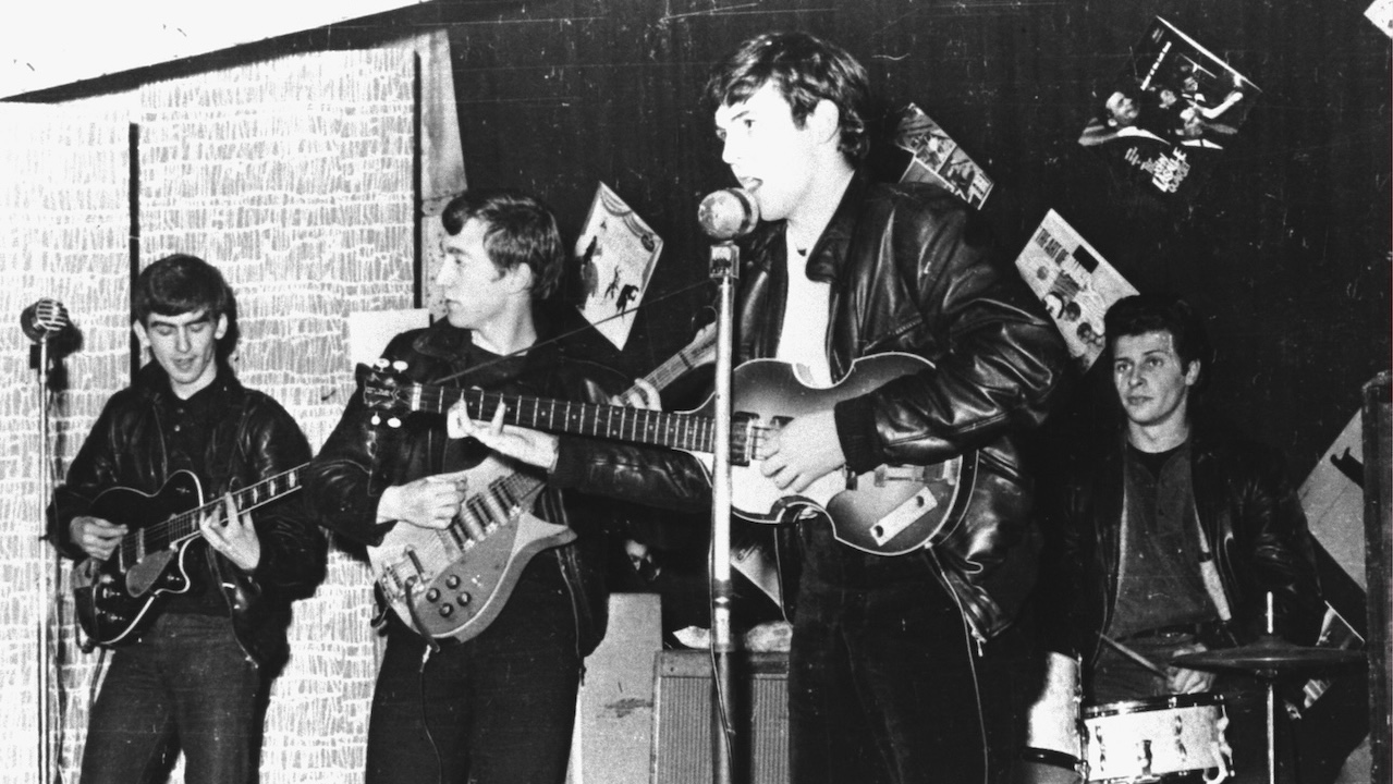 The Beatles perform in a club prior to signing their first recording contract, Liverpool, England, 1962. L-R: George Harrison, John Lennon, Paul McCartney, and original drummer Pete Best.