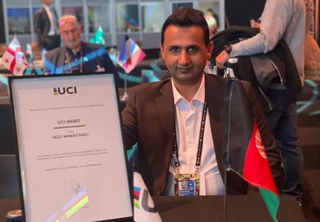 Afghanistan Cycling Federation President Fazli Ahmad Fazli with the UCI Merit in September 2021