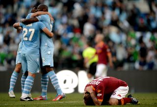 Lazio celebrate victory against Roma in the 2013 Coppa Italia final at the Stadio Olimpico.