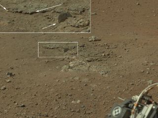 This color image from NASA's Curiosity rover, taken on Aug. 8, 2012, shows an area excavated by the blast of its sky crane rocket engines.