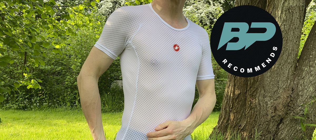 Man wearing white summer base layer T-shirt outside