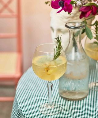 G&T tipple with lemon and burnt rosemary