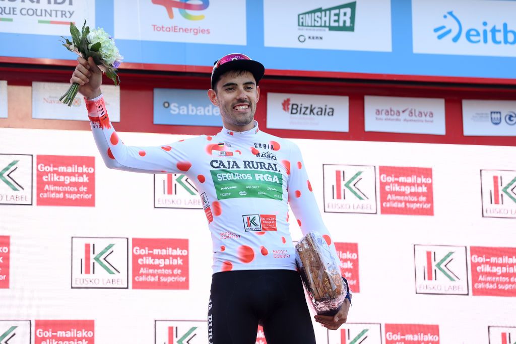 SANTURTZI SPAIN APRIL 06 Jon Barrenetxea Golzarri and Team Caja RuralSeguros RGA Polka Dot Mountain Jersey celebrates at podium during the 62nd Itzulia Basque Country Stage 4 a 1757km stage from Santurtzi to Santurtzi UCIWT on April 06 2023 in Santurtzi Spain Photo by David RamosGetty Images