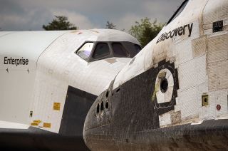 NASA space shuttles Enterprise, left, and Discovery meet nose-to-nose during their transfer at the Smithsonian in April 2012.
