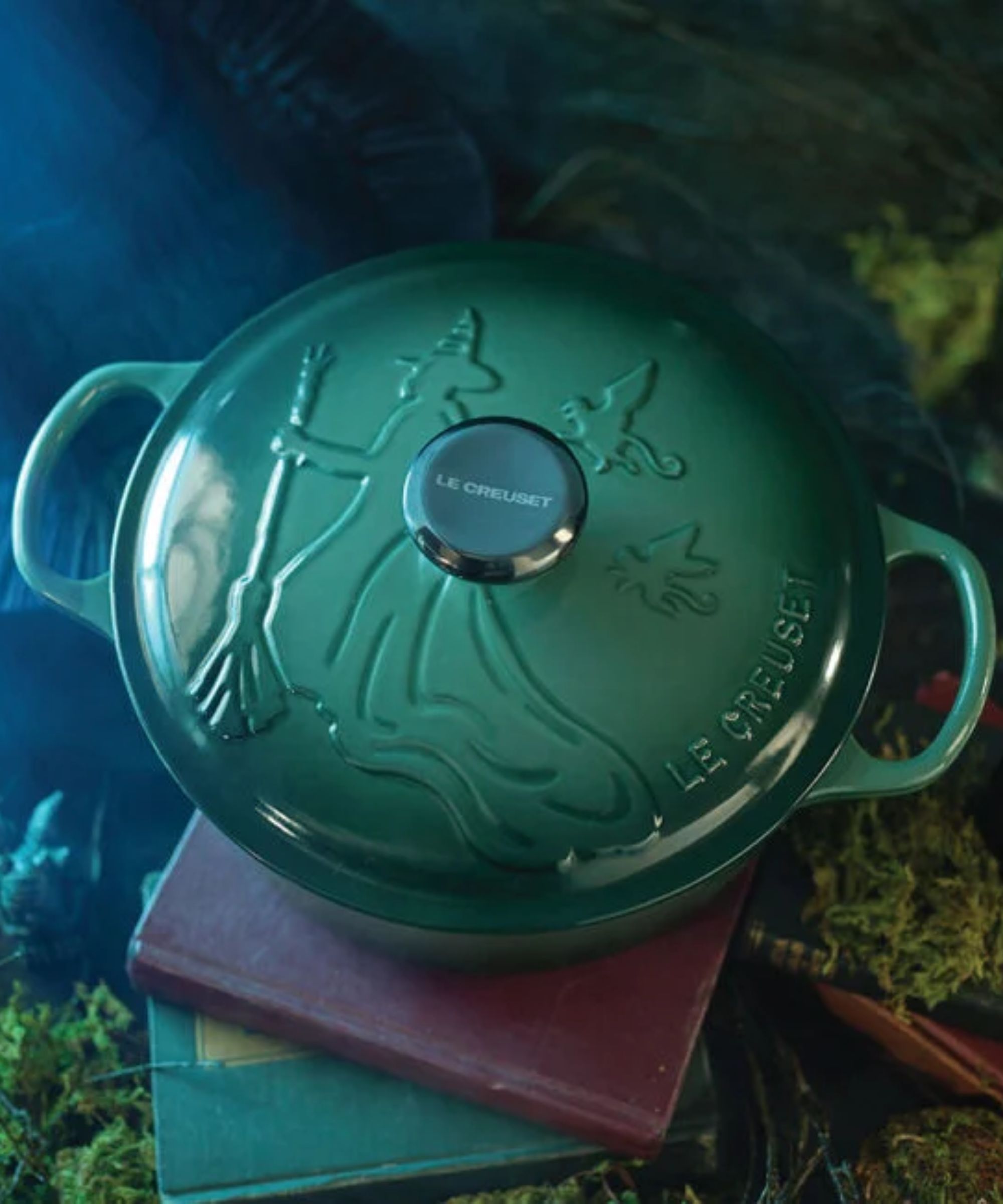 Emerald green embossed Dutch oven with witch design and black nickel nob