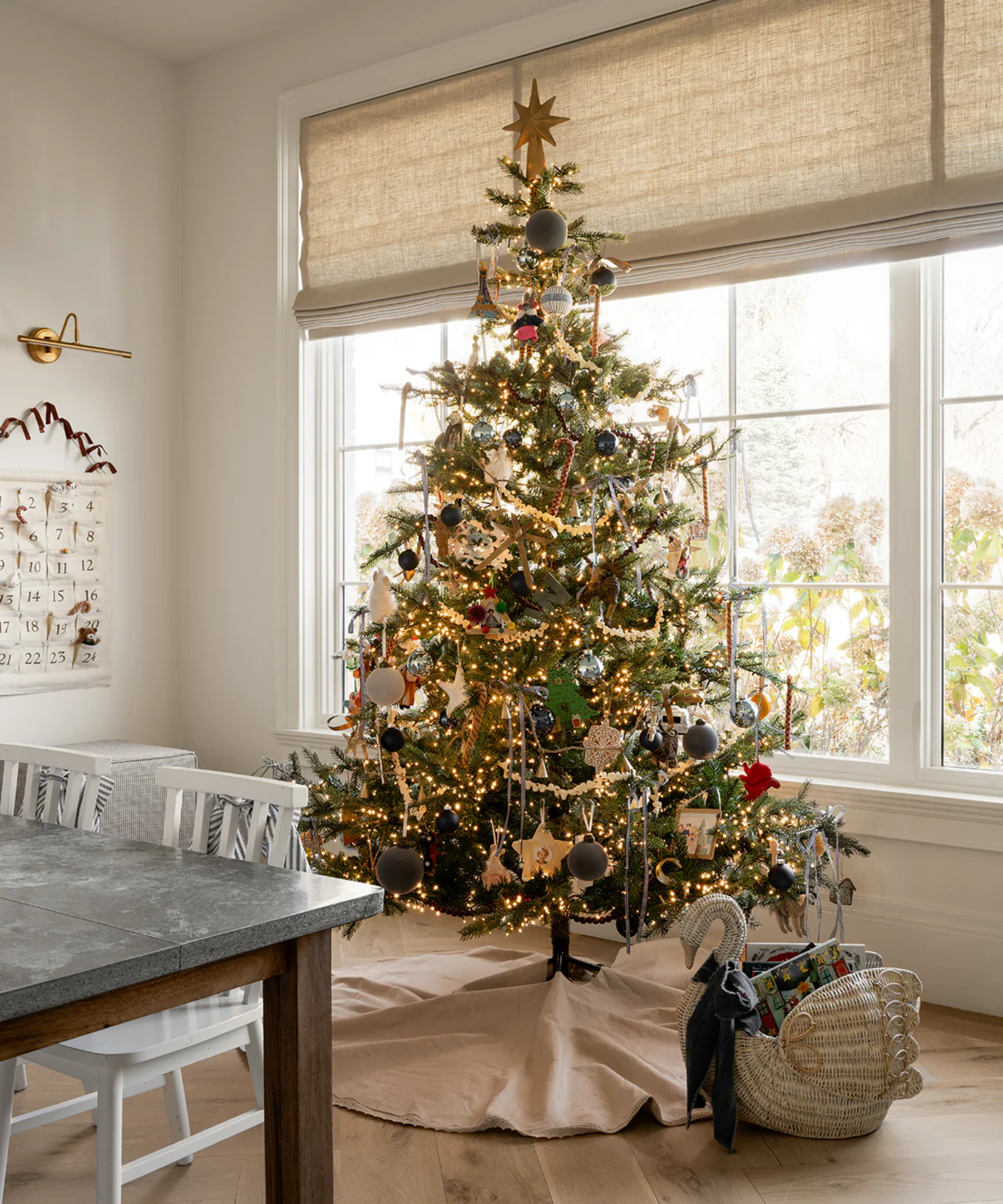 a colorful Christmas tree in a craft room