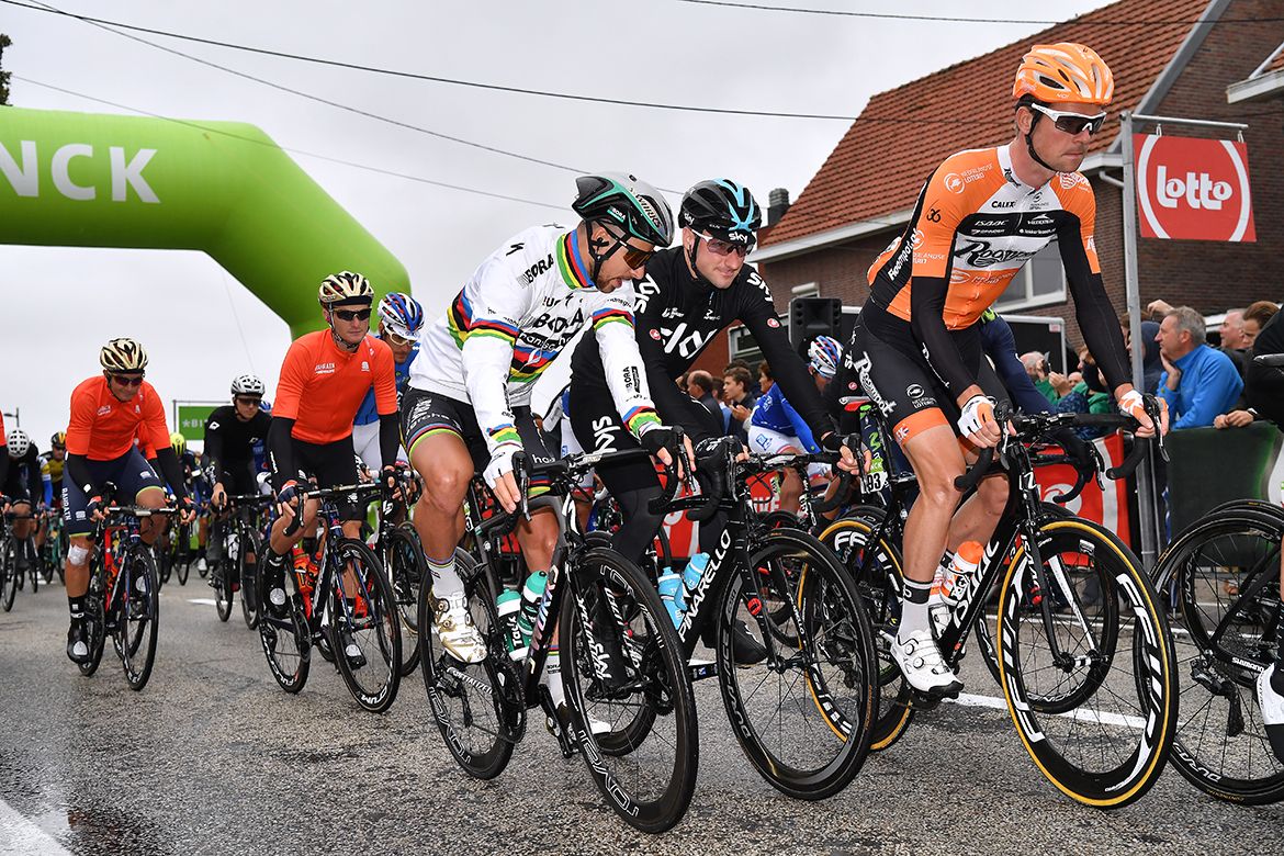 Peter Sagan chats to Elia Viviani as the riders roll out