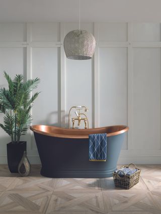 copper bath with blue painted exterior