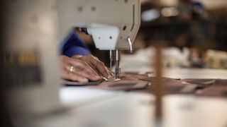 Seamstress working with sewing machine