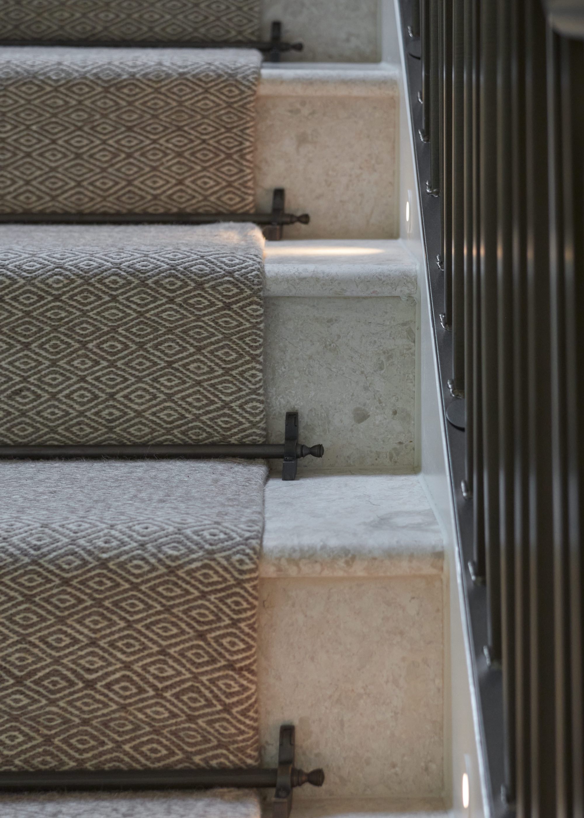 staircase close-up with black stair rods