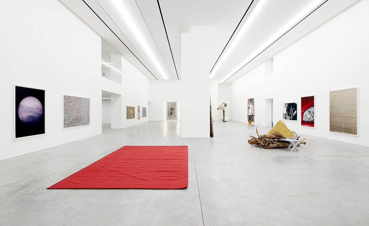 White floor with red color carpet.