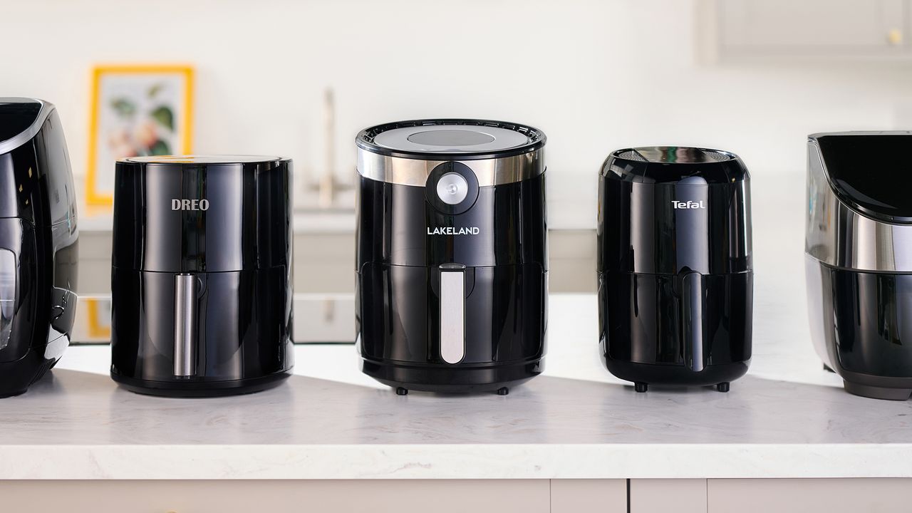 A row of air fryers on a kitchen worktop