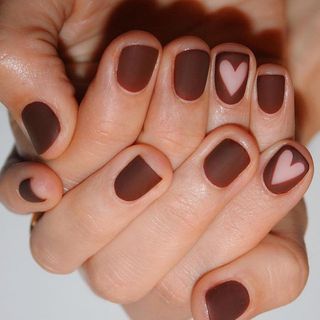 Chocolate brown nails with a heart design