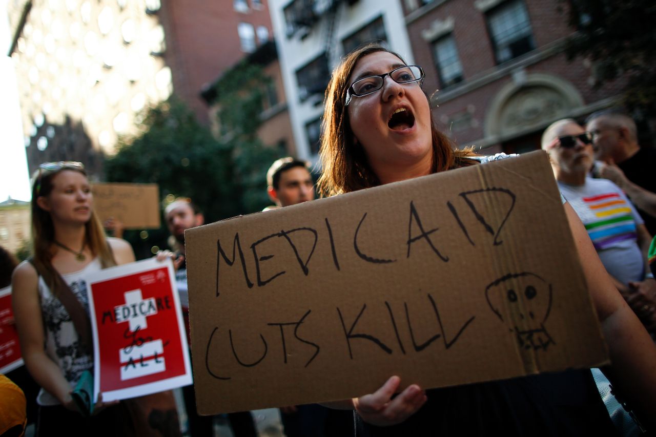 A small group of activists rally against the GOP health care plan outside of the Metropolitan Republican Club, July 5, 2017 in New York City. 