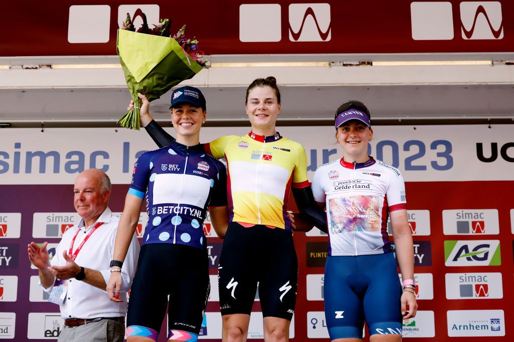 LEUVEN BELGIUM SEPTEMBER 07 LR Lieke Nooijen of The Netherlands and Team Parkhotel Valkenburg Polka dot Mountain Jersey Lotte Kopecky of Belgium and Team SD Worx Yellow leader jersey and Zoe Backstedt of The United Kingdom and Team CanyonSram Racing White best young jersey celebrate at podium during the 25th Simac Ladies Tour 2023 Stage 2 a 71km individual time trial from Leuven to Leuven UCIWWT on September 07 2023 in Leuven Belgium Photo by Bas CzerwinskiGetty Images