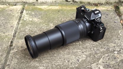 Nikon Z 28-400mm f/4-8 VR lens on a concrete surface