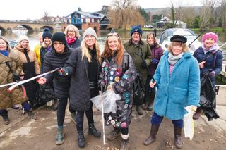 Laura Reineke stands with campaigners beside the River Thames