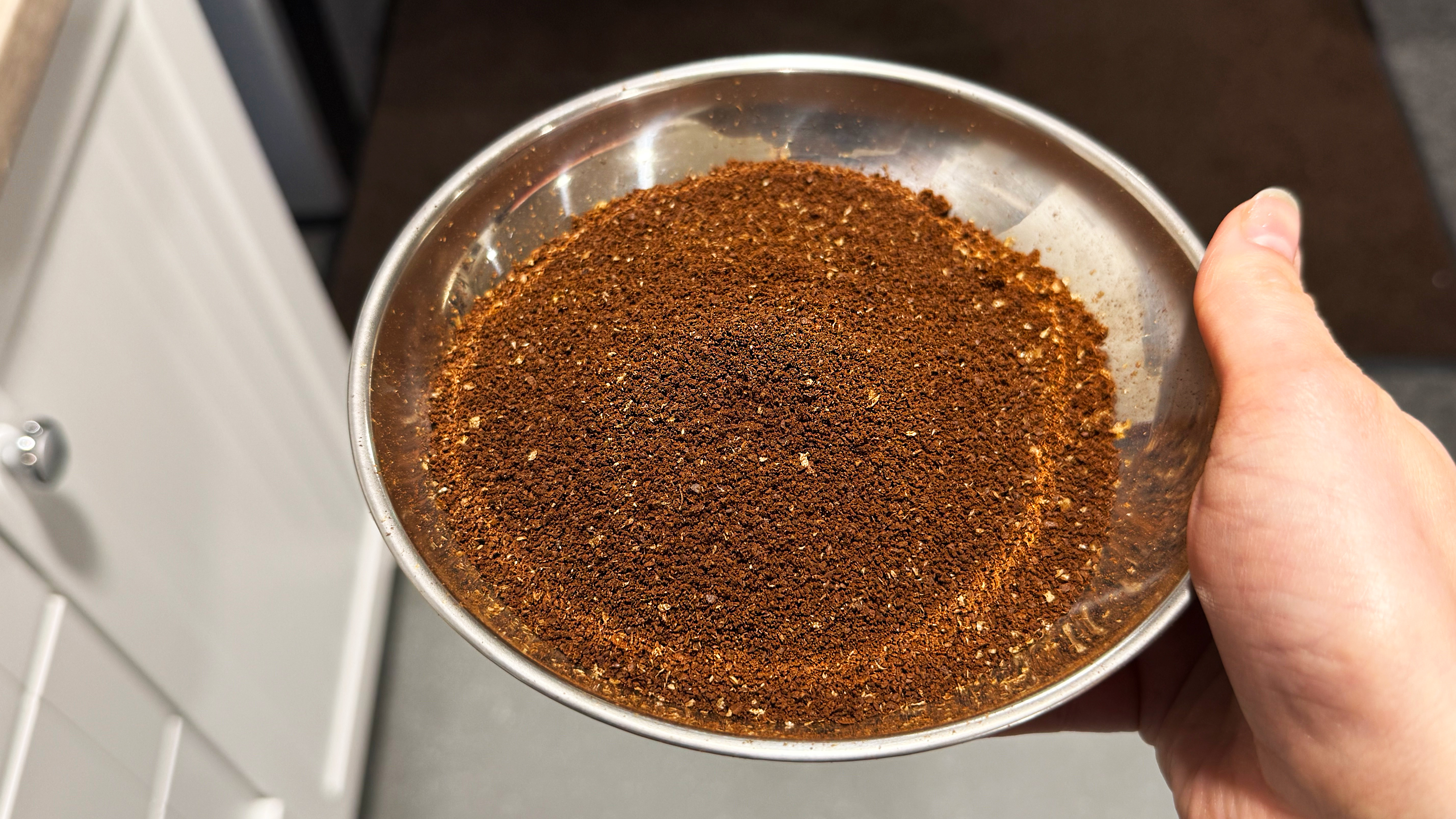a photo of coffee ground by the aeropress manual coffee grinder