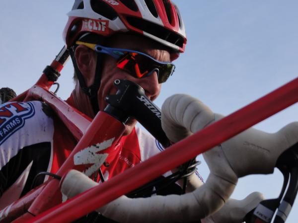 Todd Wells shoulders the bike.