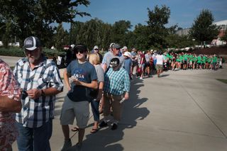 People wait to get into Saluki Stadium, on the Southern Illinois University campus, to witness the total solar eclipse. Tickets to the 15,000-seat stadium are sold out.