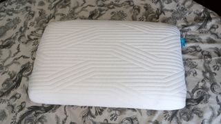 The Origin Coolmax Latex Pillow on a bed