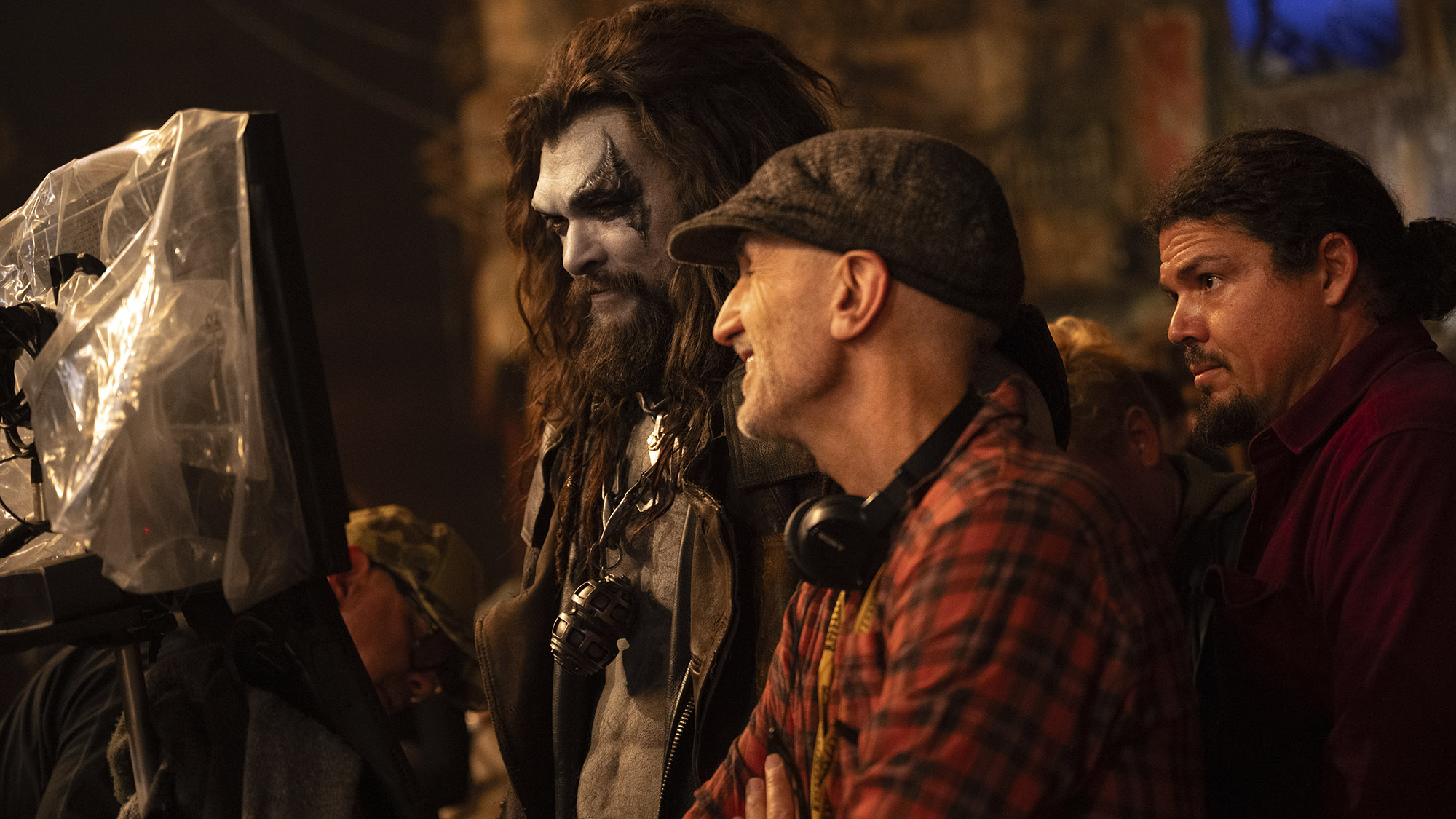 Jason Momoa as Lobo and Craig Gillespie look at a monitor on the set of Supergirl.