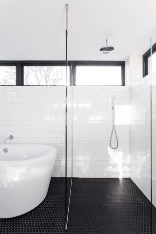 a small bathroom with clerestory windows