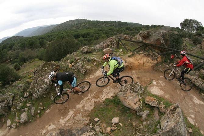 Racers round a bend during stage 3