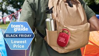 A picture of the JBL Clip 4 on a backpack with a Tom's Guide Black Friday deals badge
