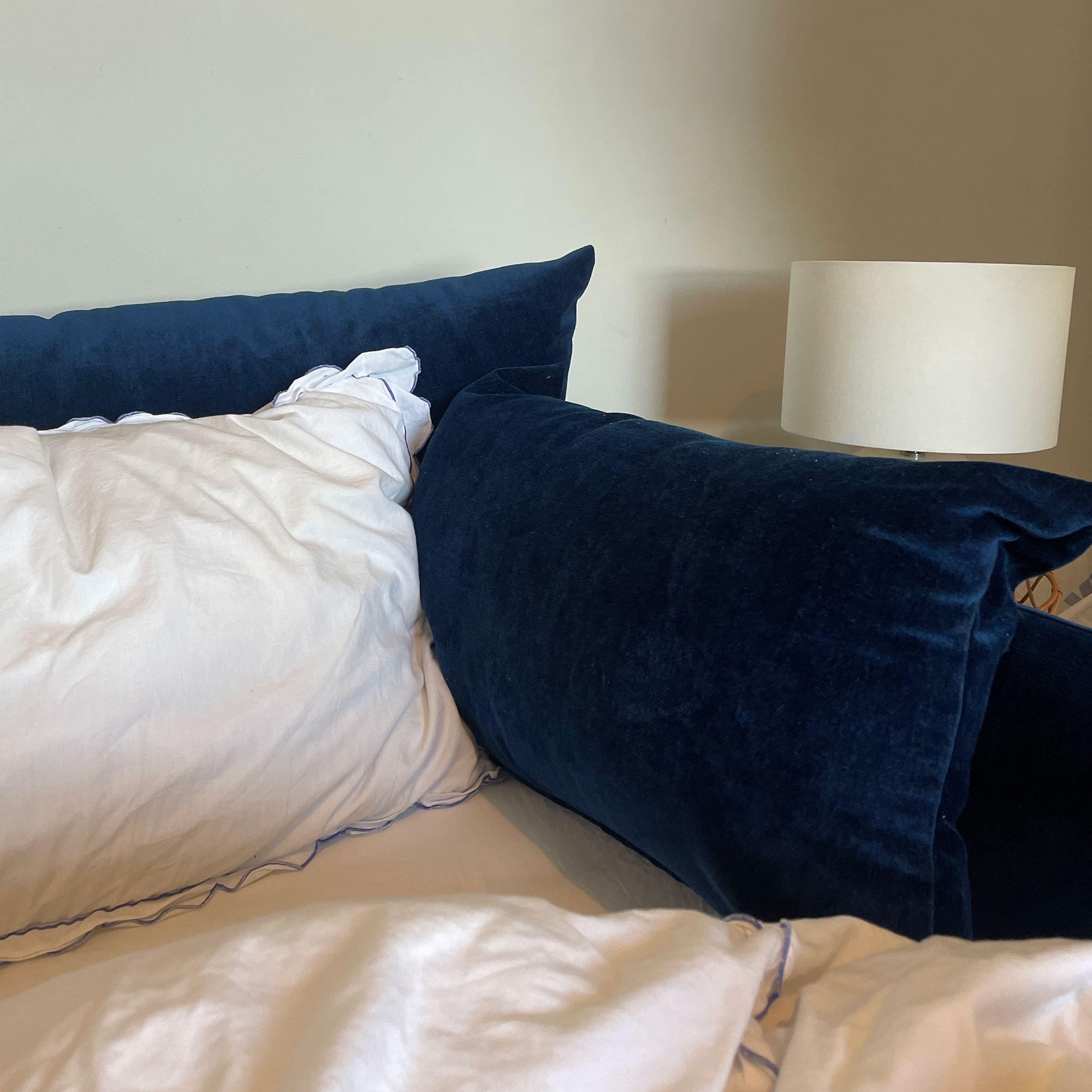 Corner of Swyft model 08 two seater sofa bed in Indigo velvet in bed mode