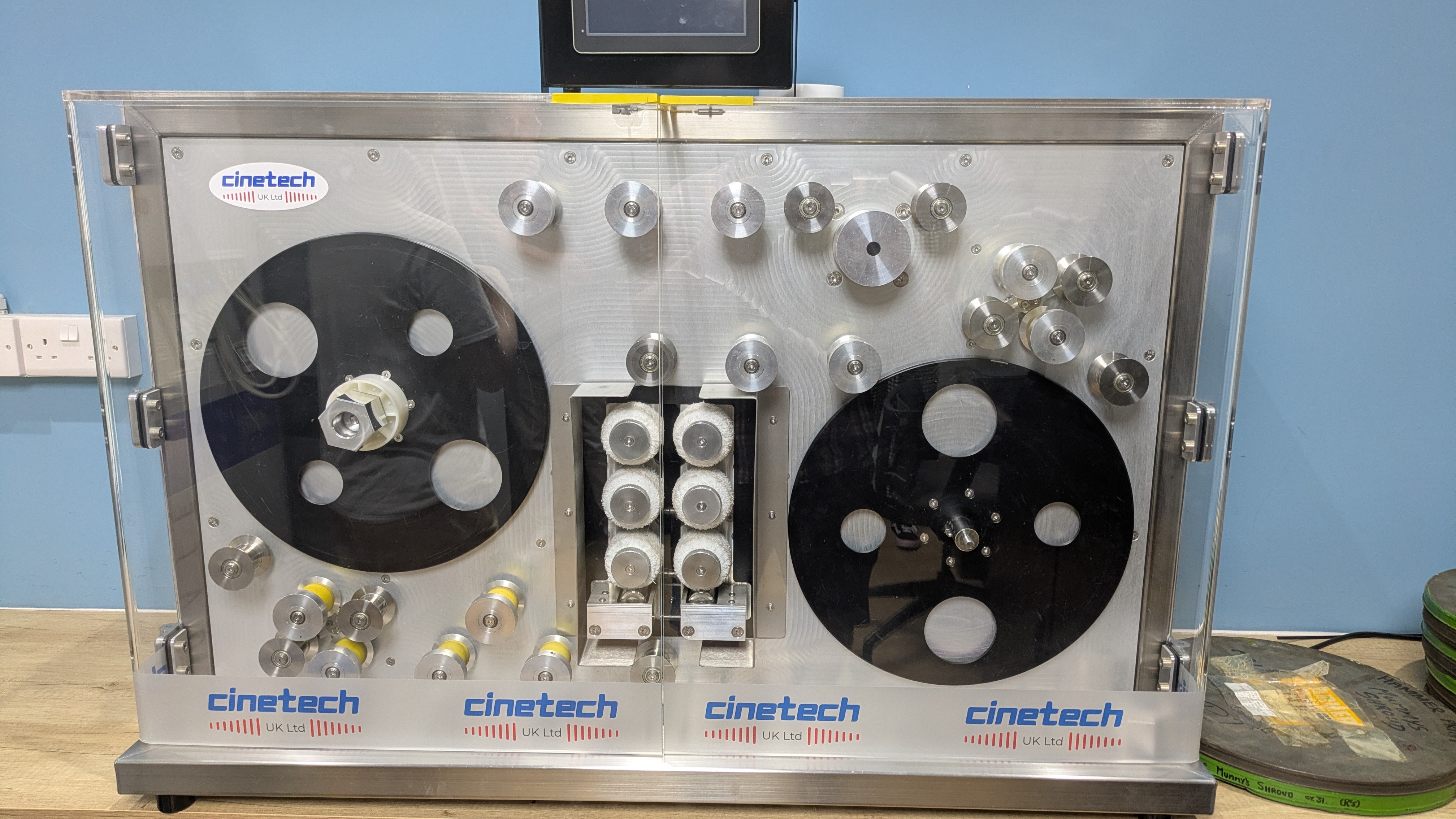 Cleaning machine at Silversalt Restoration, where film reel is cleaned before scanning