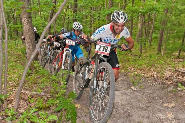 Dwayne Goscinski leads James Harmon and Mike Montalbano on the firetower climb