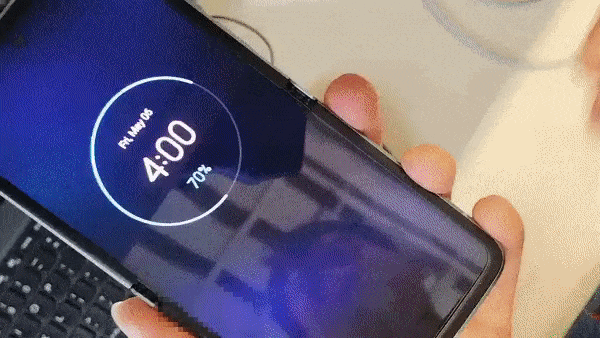 Gif of Motorola Razr 3 open and then shutting in someone's hands