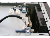Remove both fan cables and the 10-pin control cable from the backplane