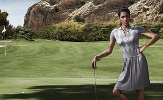 Lady on the golf green wearing Net-A-Sporter's luxe label