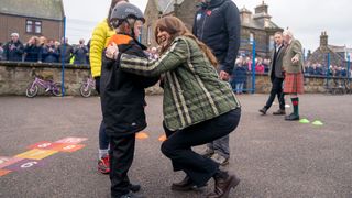 Princess Kate Middleton chatting to child after falling off his bike