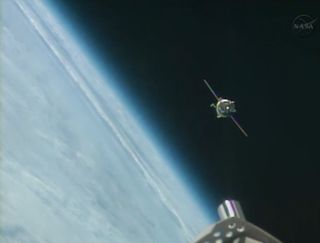 A Russian Soyuz spacecraft carrying three new crewmembers is seen approaching the International Space Station on Sept. 25, 2013. 