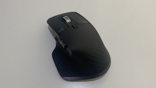 The Logitech MX Master 3S wireless mouse on a white desk