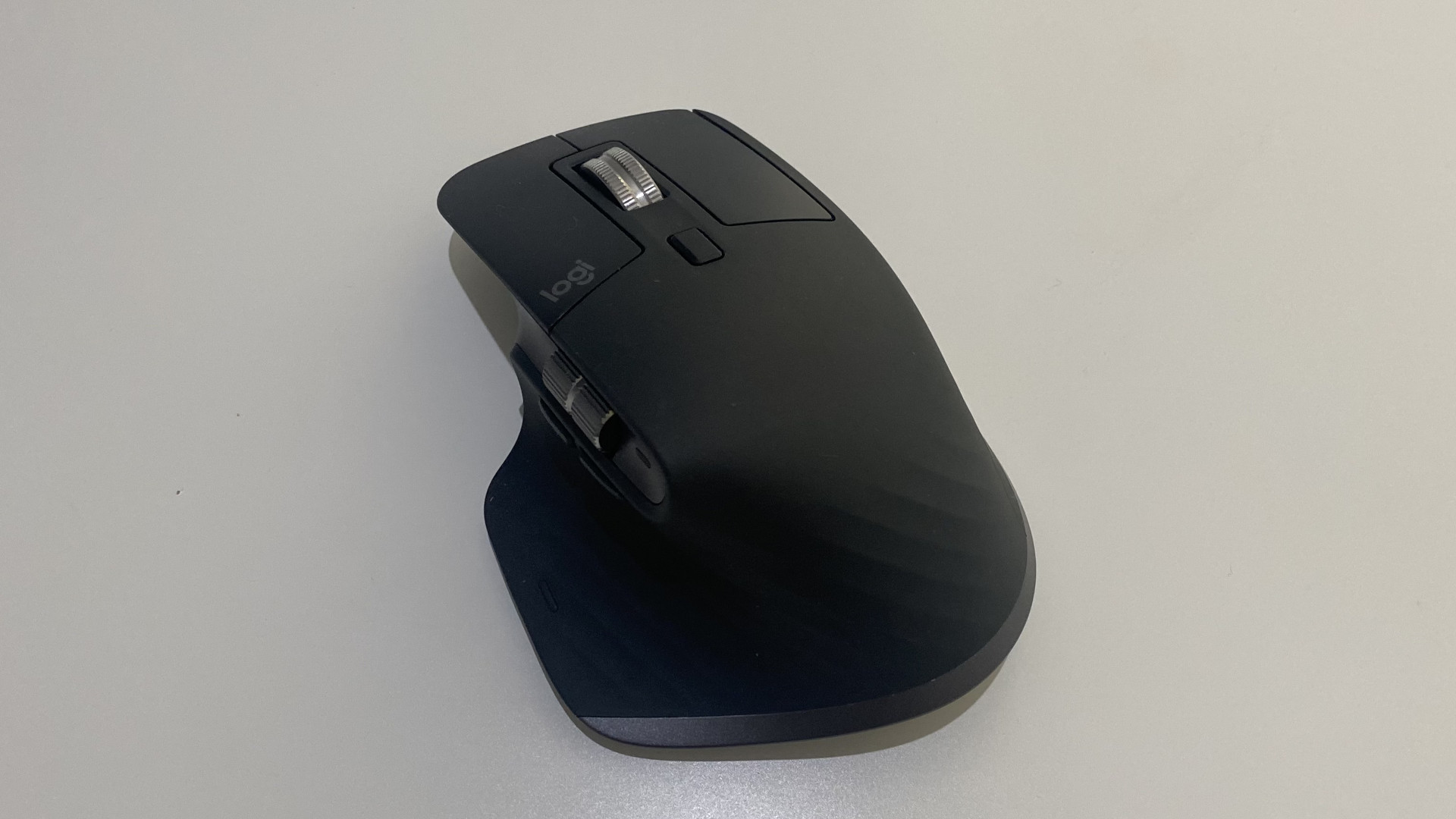 The Logitech MX Master 3S wireless mouse on a white table