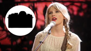 Taylor swift, wearing her hair in pigtails with a cream colored sweater, standing at a microphone, with a silhouetted camera in a white bubble next to her