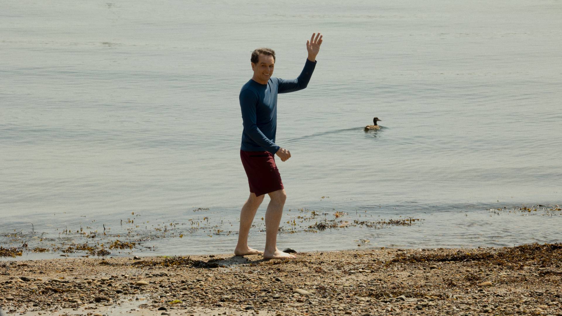 Matthew Rhys as Tom Loftis about to swim in the sea in Widow's Bay