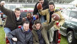 men tailgating at a football game