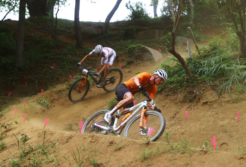 IZU JAPAN JULY 26 LR Erik Haegstad of Team Norway and Mathieu van der Poel of Team Netherlands rides during the Mens Crosscountry race on day three of the Tokyo 2020 Olympic Games at Izu Mountain Bike Course on July 26 2021 in Izu Shizuoka Japan Photo by Tim de WaeleGetty Images