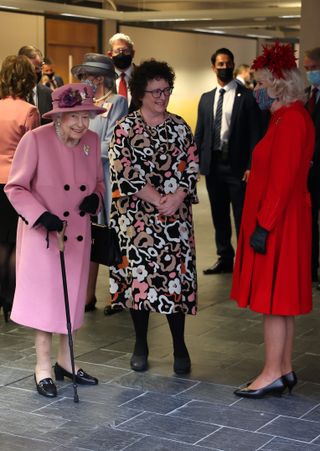 Queen Elizabeth II, Elin Jones, Llywydd of the Senedd and Camilla, Duchess of Cornwall talk during the opening ceremony of the sixth session of the Senedd at The Senedd on October 14, 2021 in Cardiff, Wales.