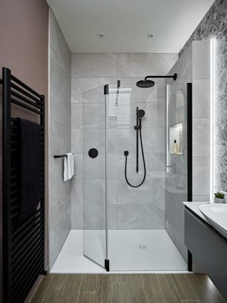 hinged shower door in modern bathroom with walk-in shower