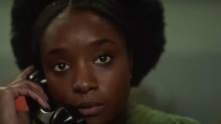 KiKi Layne making a phone call in If Beale Street Could Talk