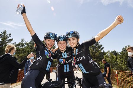 Team DSM celebrate Juliette Labous winning the overall title at Vuelta a Burgos Feminas