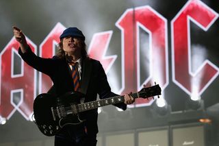 A picture of Angus Young performing with AC/DC