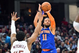 Jalen Brunson #11 of the New York Knicks shoots over Donovan Mitchell #45 of the Cleveland Cavaliers during the second quarter at Rocket Mortgage Fieldhouse on March 31, 2023 in Cleveland, Ohio.